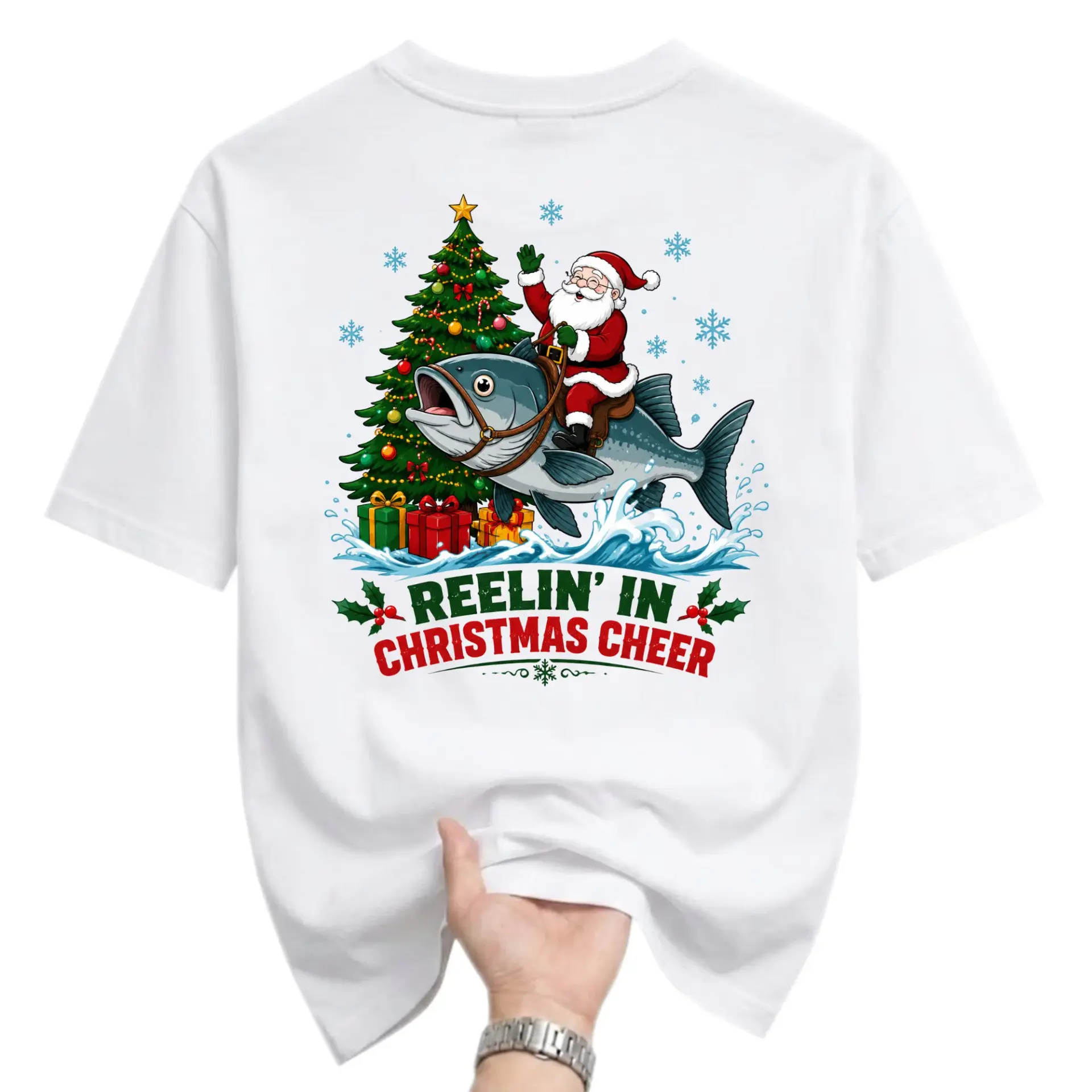 Funny Shirt Reelin in Christmas Cheer Graphic Tee Featuring Santa Claus Riding a Giant Fish Holiday Seasonal Apparel
