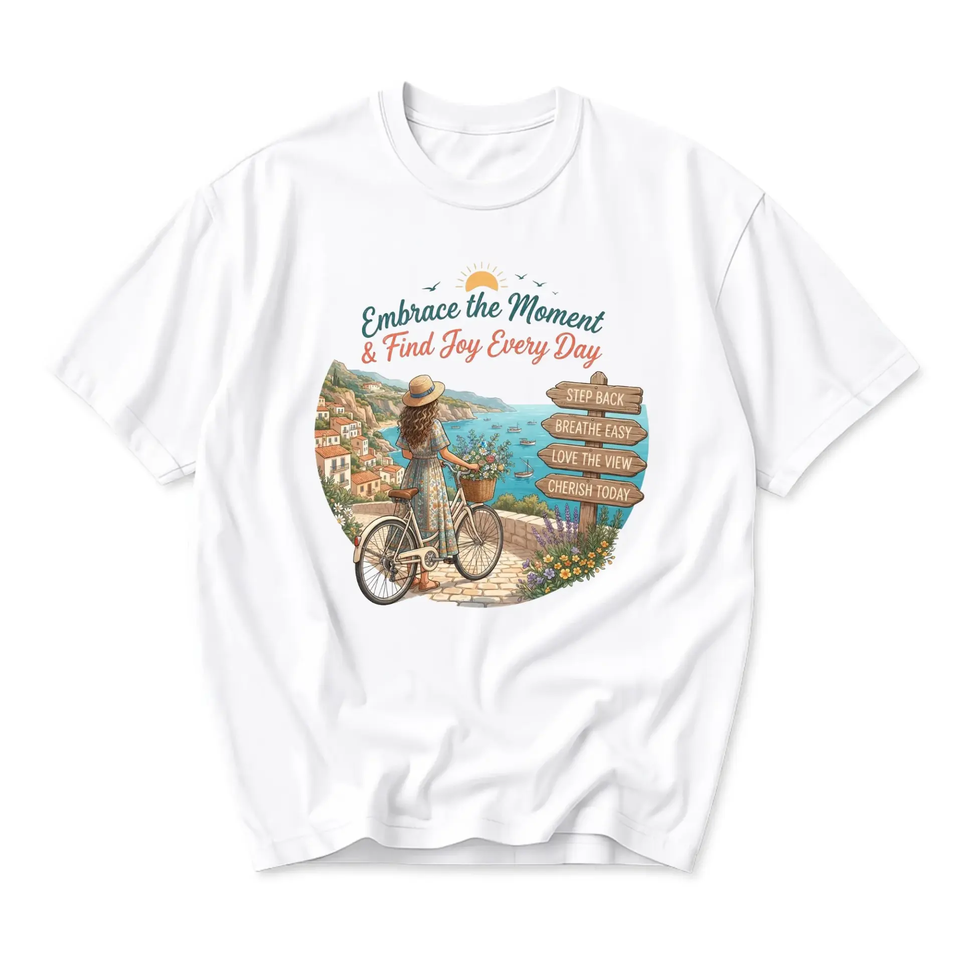 T-shirt Embrace the Moment Graphic Tee Featuring a Woman on a Bicycle Overlooking a Beautiful Seaside Coastal Village